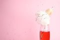 Cocktail with cotton candy in glass on pink background Royalty Free Stock Photo