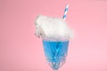 Cocktail with cotton candy in glass on pink , closeup view Royalty Free Stock Photo