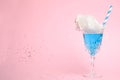Cocktail with cotton candy in glass on pink , space for text Royalty Free Stock Photo