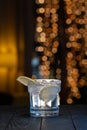 Cocktail drink in bar. Gin tonic cocktail in front of a brown gold background. Royalty Free Stock Photo