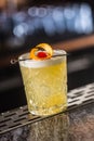 Cocktail drink whiskey sour at barcounter in night club or restaurant Royalty Free Stock Photo