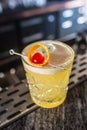 Cocktail drink whiskey sour at barcounter in night club or restaurant Royalty Free Stock Photo