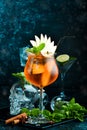 Cocktail in a glass - Aperol spritz. on a black stone background. Menu bar. Alcohol