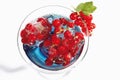 Cocktail glass with Blue Curacao and frozen red currants Royalty Free Stock Photo