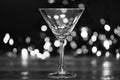 Cocktail glass on defocused garland colorful lights. What to drink on christmas party. Alcohol cocktail for winter party Royalty Free Stock Photo
