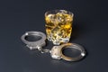Cocktail and handcuffs Royalty Free Stock Photo