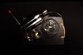 overhead shot with black background of four cocktail instruments including jigger, martini glass, shaker and cocktail spoon Royalty Free Stock Photo