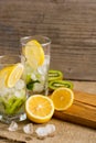 Cocktail with kiwi and mint in a glass on a wooden background. Selective focus. Homemade lemonade with kiwi