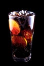 Cocktail Long Island Iced Tea on a black background. Royalty Free Stock Photo