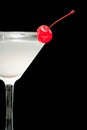 Cocktail in martini glass with red cherry closeup Royalty Free Stock Photo