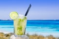 Cocktail mojito ice lemon straws in tropical beach Royalty Free Stock Photo
