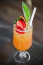 Cocktail of orange juice in a glass with strawberries, selective focus Royalty Free Stock Photo