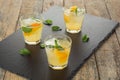 Cocktail. Orange juice with mint and ice on rustic wooden table Royalty Free Stock Photo