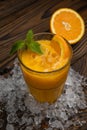 Orange juice with mint and ice rustic wooden table Royalty Free Stock Photo