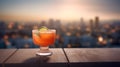 Cocktail with orange and lime on wooden table with cityscape background Royalty Free Stock Photo