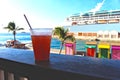 Cocktail overlooking cruise ship and the waters of Nassau, Bahamas