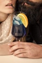 Cocktail party. Young couple drinking cocktail Royalty Free Stock Photo