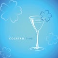 Cocktail time glass with flower decoration on blue background Royalty Free Stock Photo
