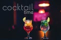 Cocktail Time. Two glasses of drinks with fruit slices and ice cubes Royalty Free Stock Photo