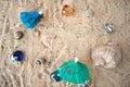 Cocktail umbrellas on the sand of a sunny beach. Royalty Free Stock Photo