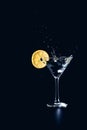 Cocktail water drink splash in the glass with lemon Isolated on black Royalty Free Stock Photo