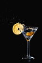 Cocktail water drink splash in the glass with lemon Isolated on black Royalty Free Stock Photo