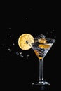 Cocktail water drink splash in the glass with lemon Isolated on black Royalty Free Stock Photo