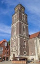 Cocktailbar and church tower on the square in Coesfeld