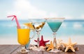 Cocktails juice and starfishes Royalty Free Stock Photo