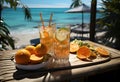 Cocktails with oranges and lime on a wooden table on the beach