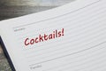 Cocktails reminder note in red ink in a diary page Royalty Free Stock Photo