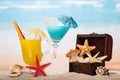 Cocktails and starfishes on beach Royalty Free Stock Photo