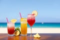 Cocktails on a tropical beach with blue sea and sky background. Summer vacation concept. Teasty cocktail. Beautyful background.