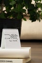 Coco Chanel quotes written on a block note, inspiration phrase