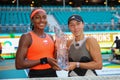 Coco Gauff (L) and Jessica Pegula of USA pose with the trophy after the women\'s doubles final at 2023 Miami Open