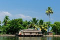 Coco trees reflection and beautifoull house boat