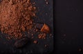 Cocoa beans and cacao powder on dark background Royalty Free Stock Photo