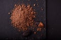 Cocoa beans and cacao powder on dark background Royalty Free Stock Photo
