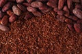 Cocoa beans and grated chocolate background Royalty Free Stock Photo