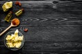 Cocoa butter as ingredient for natural cosmetics. Dark wooden background top view copy space