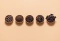 Cocoa and chocolate ingredients in bowls. Cacao beans and chocolate assortment top view
