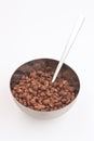 Cocoa coated puffed rice in metal bowl