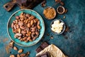 Cocoa. Cocoa beans, dark bitter chocolate chunks, cacao butter and cocoa powder Royalty Free Stock Photo