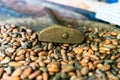 Cocoa concept with raw, peeled, and crushed cocoa beans being roasted traditionally in El Salvador