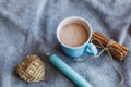 cocoa cup cinnamon sticks and knitted heart