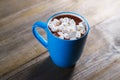 Cocoa with marshmallow, close up. Warming sweet drink, coziness,