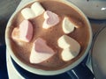 Cocoa with marshmallow. Hot chocolate with heart shaped marshmellow sweets. Romantic drink