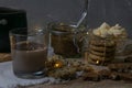 Cocoa with marshmallows and chocolate oven and slices of chocolate stands on a wooden table Royalty Free Stock Photo