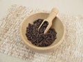 Cocoa nibs in wooden bowl
