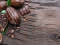 Cocoa pod, cocoa beans and chocolate on the wooden table. Top view Royalty Free Stock Photo